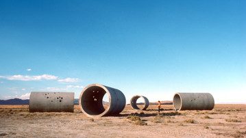 Nancy Holt, Sun Tunnels, 1973-76<br/>Great Basin Desert, Utah<br/>Concrete, steel, earth<br/>Overall dimensions: 9 ft. 2-1/2 in. x 86 ft. x 53 ft. (2.8 x 26.2 x 16.2 m); length on the diagonal: 86 ft. (26.2 m)<br/>Photograph: Nancy Holt<br/>Collection Dia Art Foundation with support from Holt/Smithson Foundation<br/>© Holt/Smithson Foundation and Dia Art Foundation, licensed by Artists Rights Society (ARS), New York